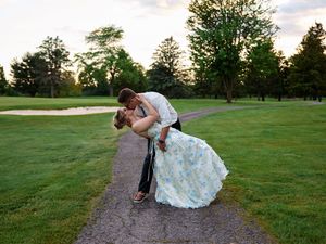 A romantic dip pose between newlyweds at a golf course during sunset.

Indiana Weddings
Illinois Weddings
Michigan Weddings
Weddings
