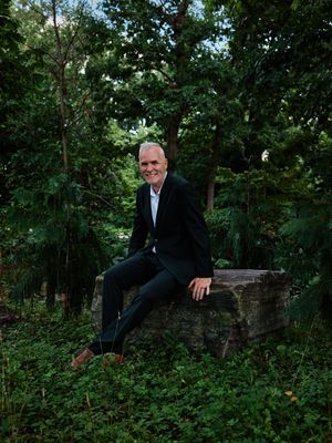 Groom sits casually on a stone wall surrounded by lush foliage.

Indiana Weddings
Illinois Weddings
Michigan Weddings
Weddings