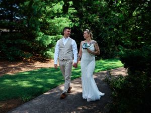 A couple walks together through a lush garden pathway on their wedding day.

Indiana Weddings
Illinois Weddings
Michigan Weddings
Weddings