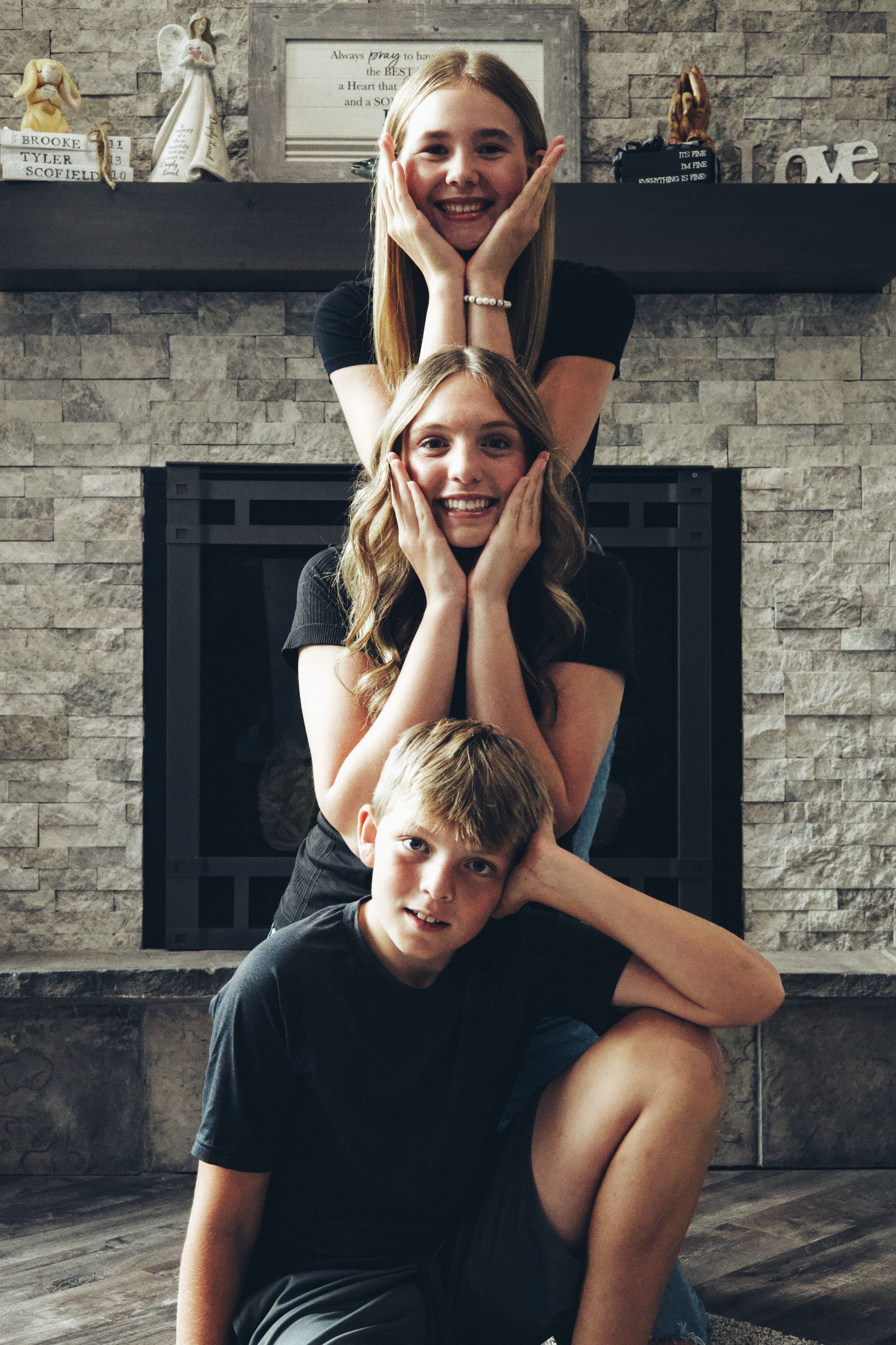 A series of five candid lifestyle photos showing playful poses and expressions against a stone wall background.