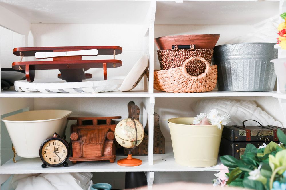 Shelving unit displaying newborn studio props in Carlsbad New Mexico. Newborn Photography. Maternity Photography. Newborn Pictures