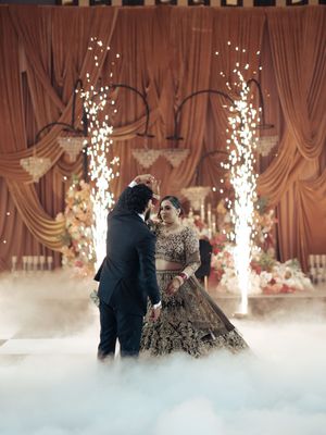 Dramatic wedding dance scene with fog effects and sparkler fountains creating magical atmosphere.