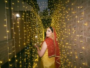 Glowing fairy light curtain display creating a magical golden backdrop for an evening celebration.