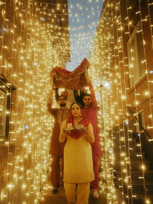 Romantic wedding portraits with cascading fairy light curtains creating a magical golden glow.