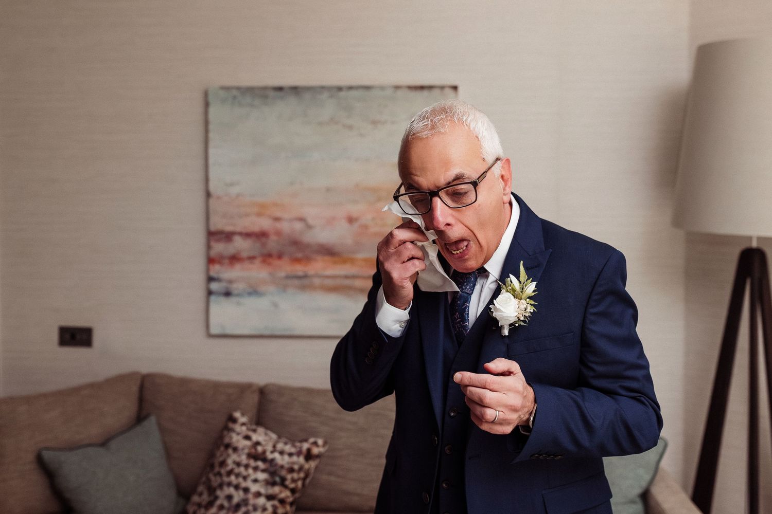 Natural wedding moments at Lodore Falls Hotel - father of the bride sheds a tear