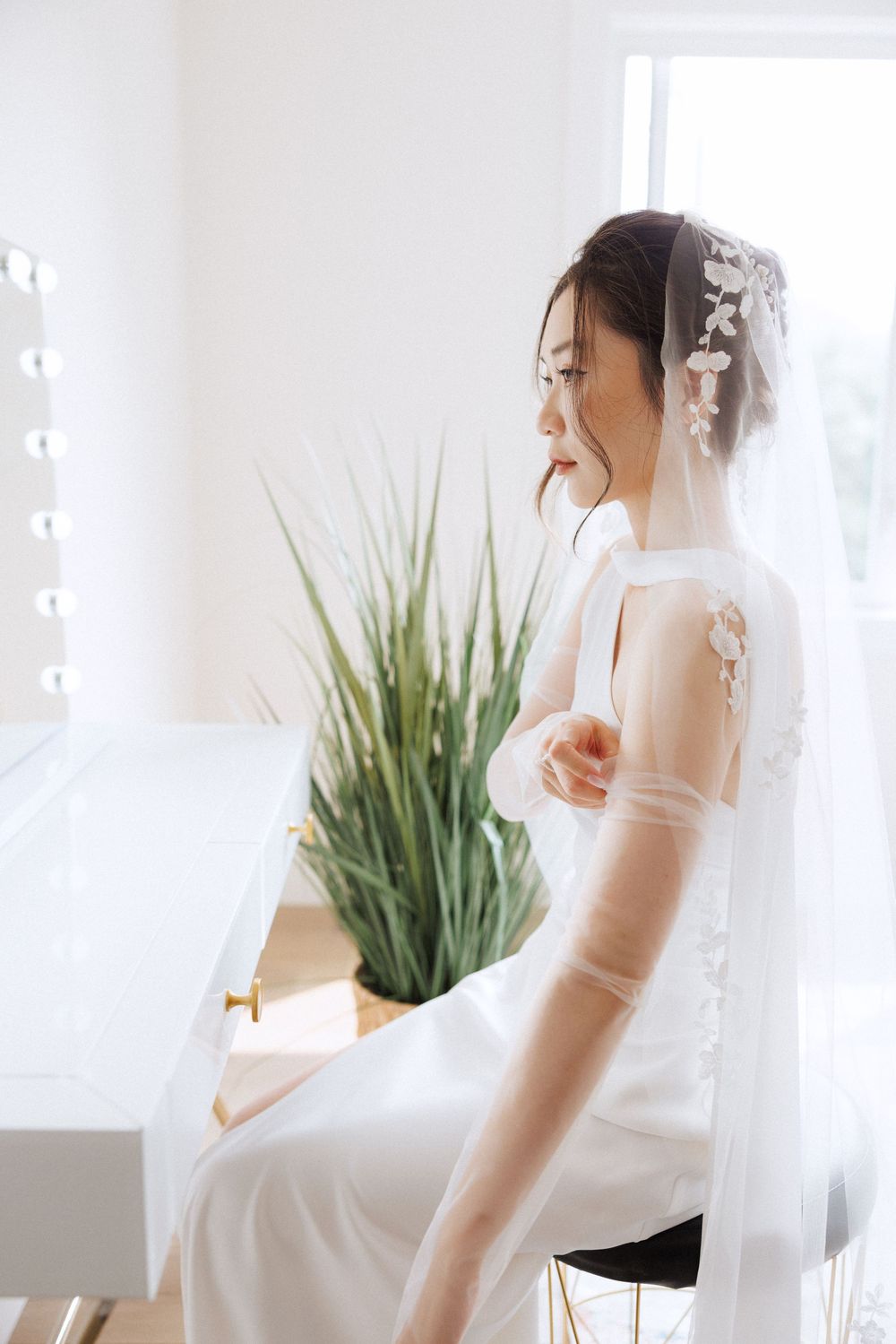 Bride getting ready in Portugal Cove captured by Newfoundland documentary style wedding photographer Kaitlyn Yvette