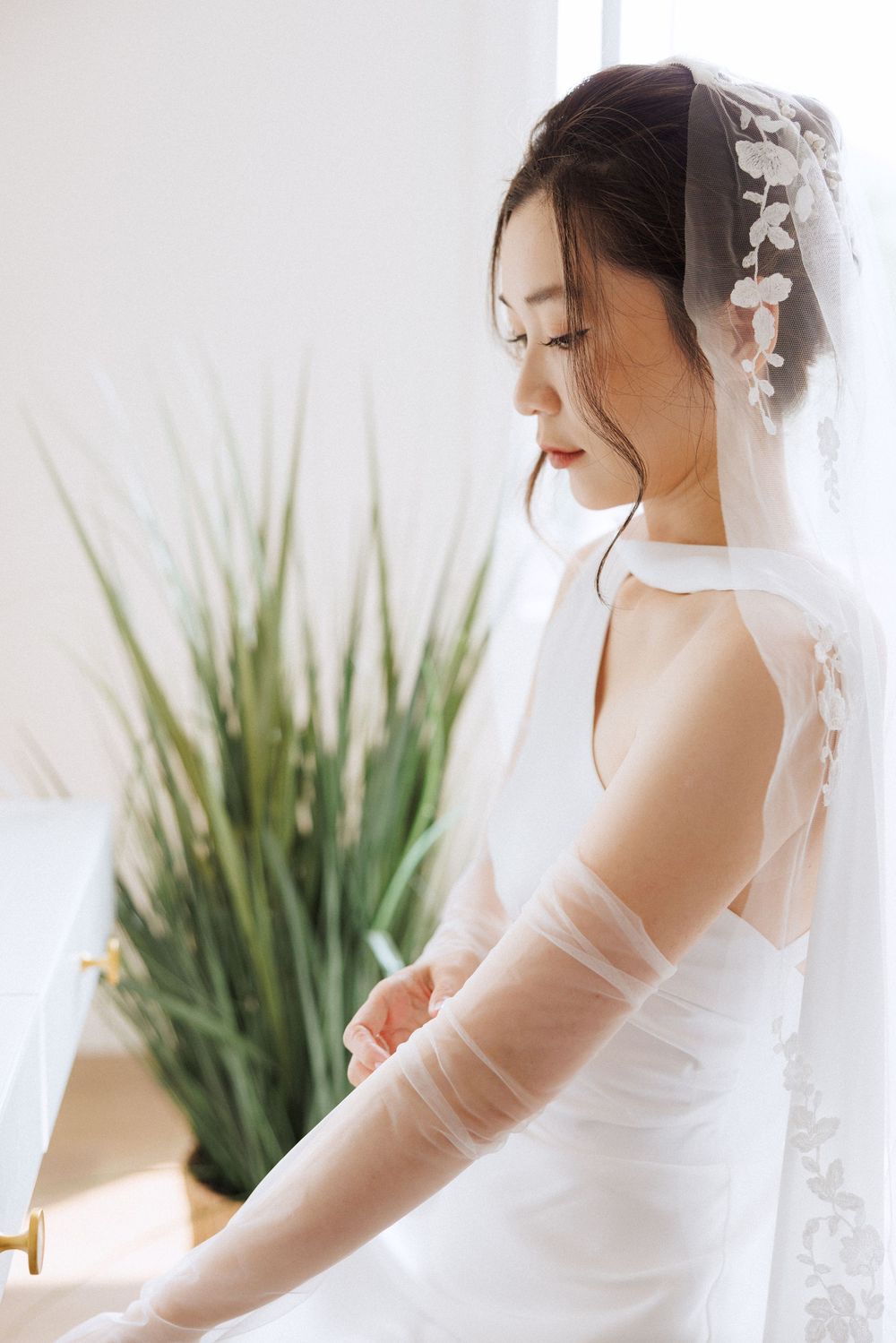 Bride getting ready in Portugal Cove captured by Newfoundland documentary style wedding photographer Kaitlyn Yvette
