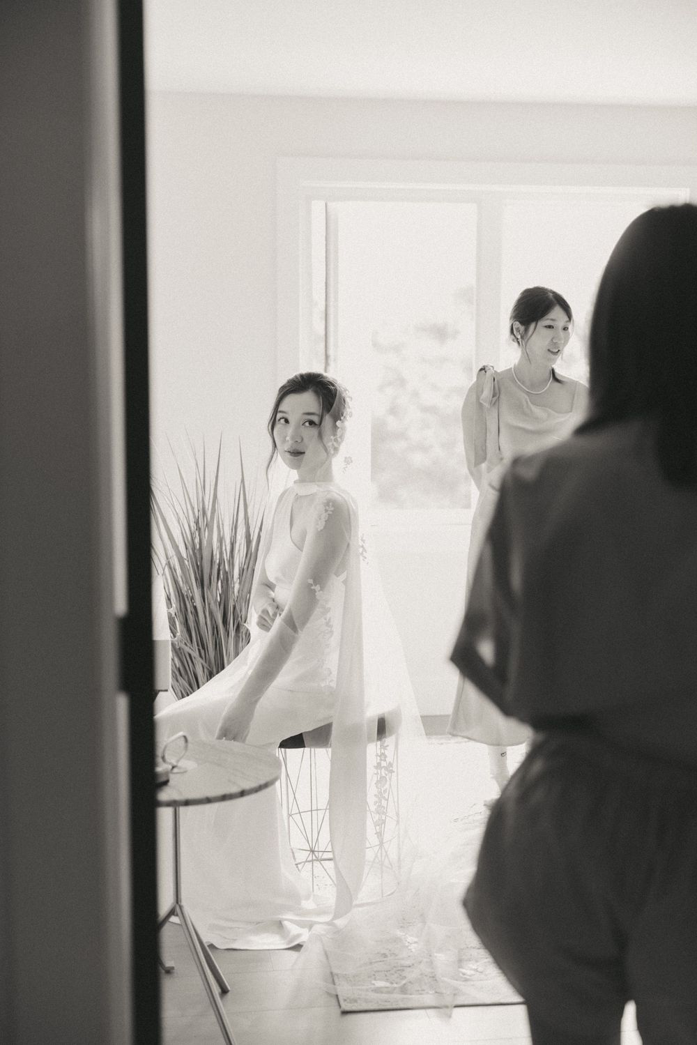 Bride and friends getting ready in Portugal Cove captured by Newfoundland documentary style wedding photographer Kaitlyn Yvette