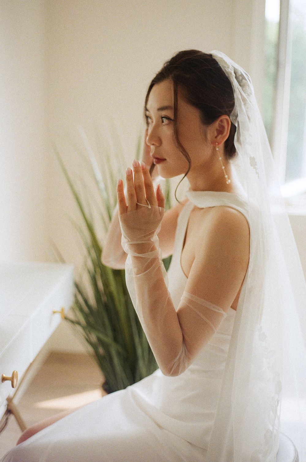 Bride getting ready in Portugal Cove captured by Newfoundland documentary style wedding photographer Kaitlyn Yvette