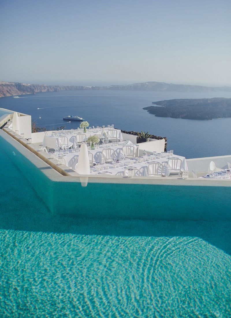 Infinity pool and terrace at Grace Hotel Santorini overlooking the caldera
