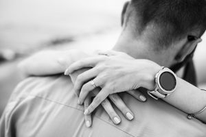Professional massage therapist applying therapeutic pressure to client's back during relaxation treatment.