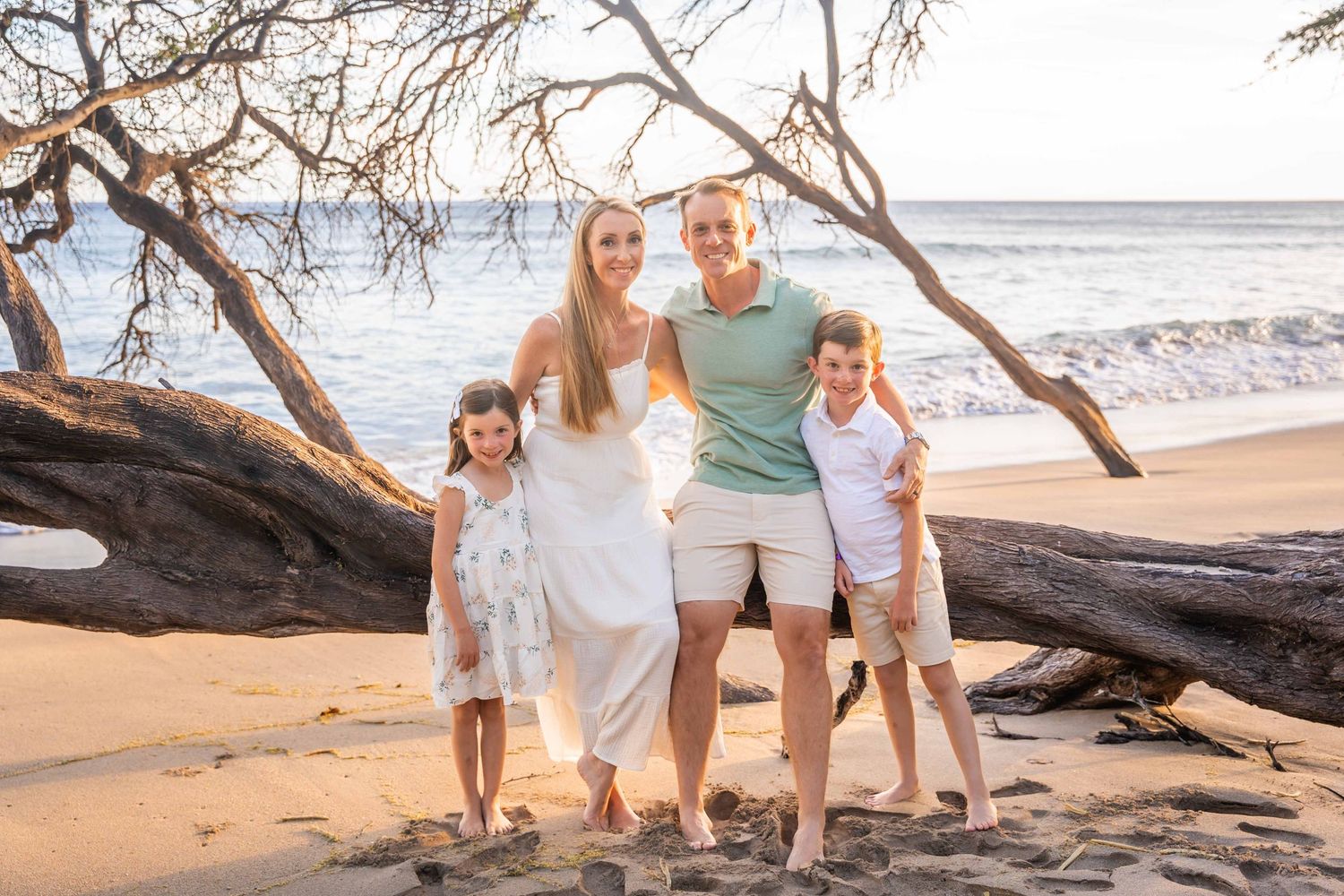 Maui family photographer photo against beautiful Maui sunset beach by ohwowfotos.