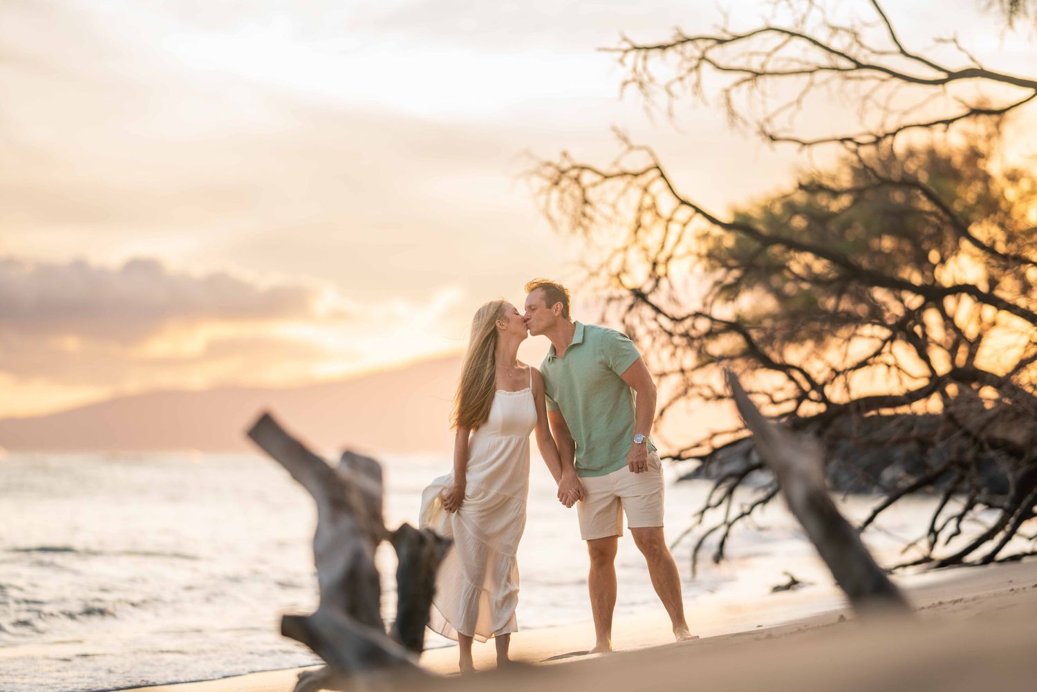 Maui family photographer photo against beautiful Maui sunset beach by ohwowfotos.