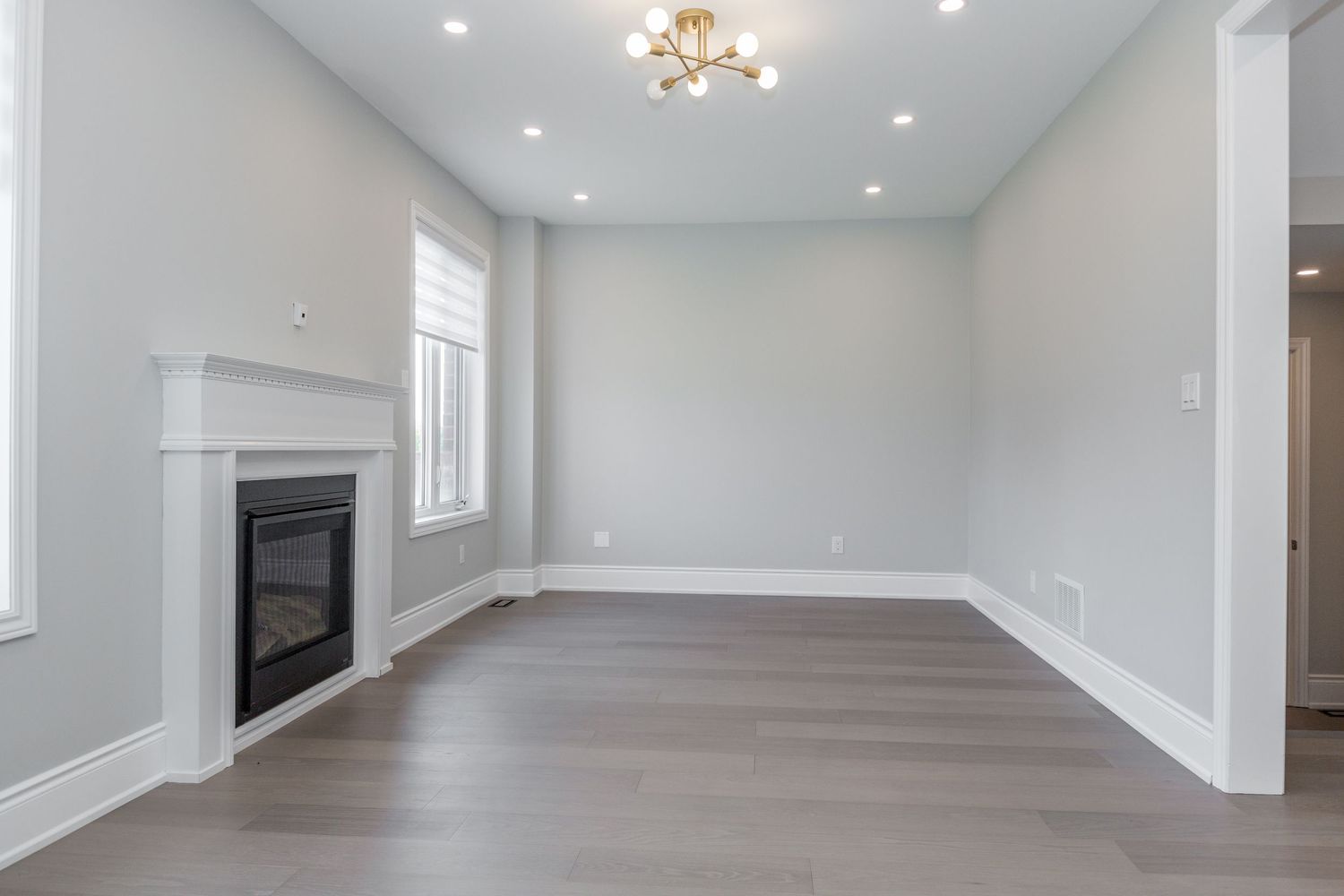 A photo of a vacant living room in Springwater Ontario for a real estate listing in Simcoe County photographed by Sarah Tennant