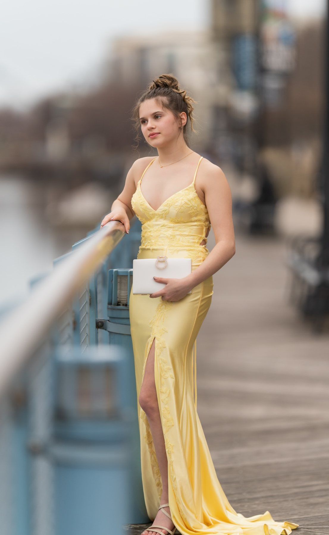 Prom portrait inspired by Andie Anderson featuring Ava in a yellow prom dress at the Wilmington Riverfront.