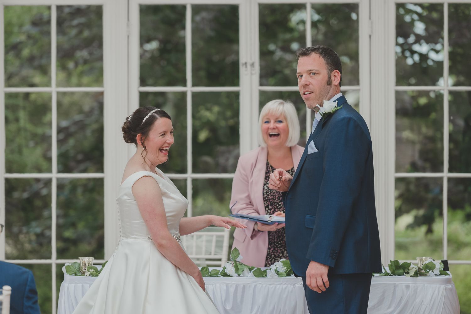 A series of candid wedding moments captured in a sunlit conservatory with white window frames.