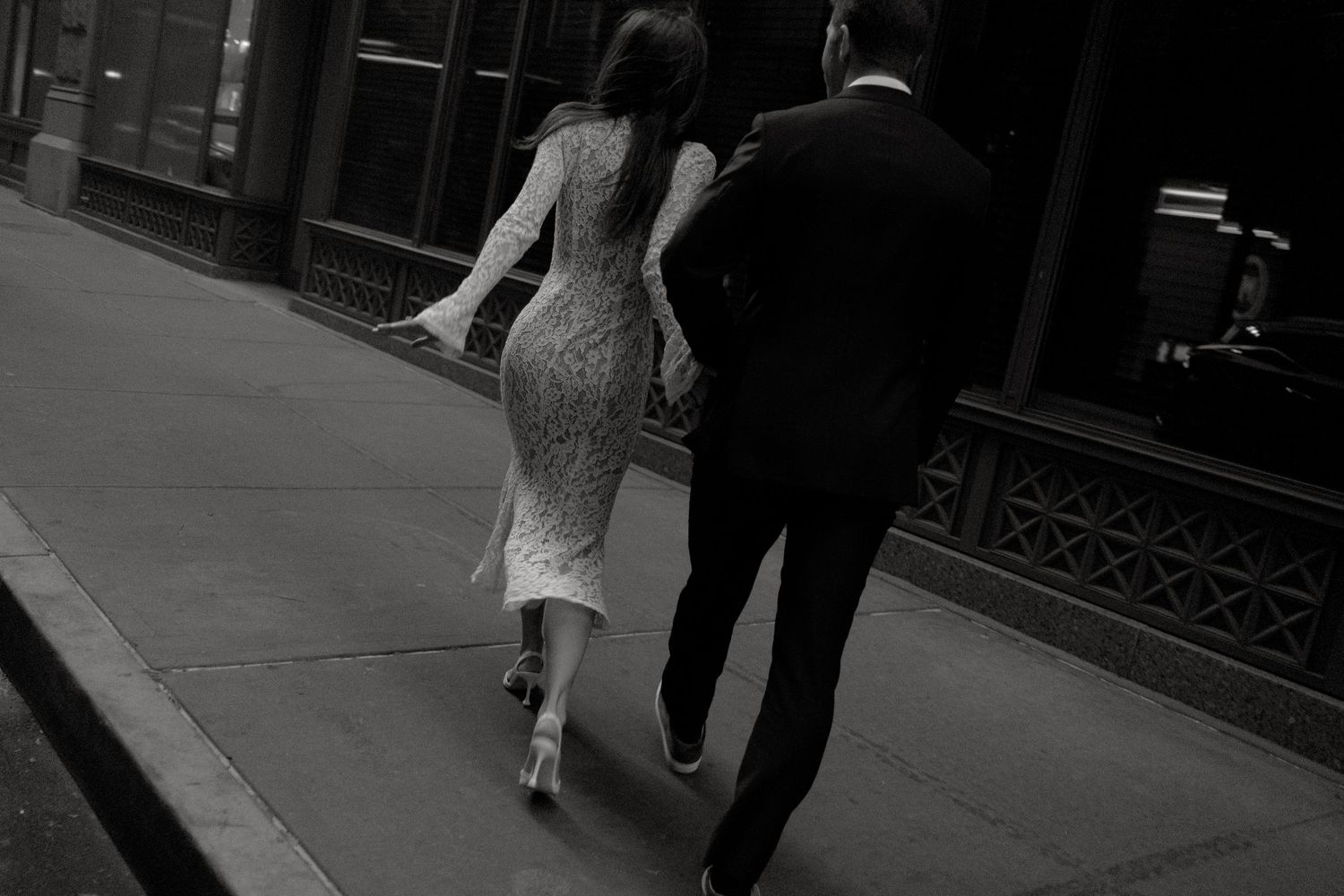 Intimate black and white portrait of a couple sharing a tender romantic moment together.