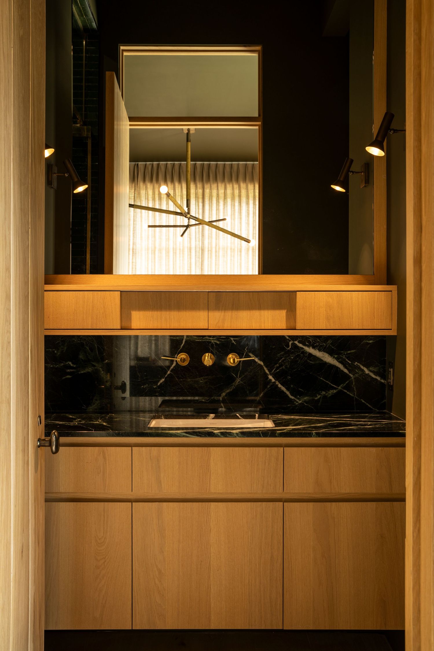 Modern interior design featuring wood paneling and recessed lighting creates a warm, contemporary ambiance.