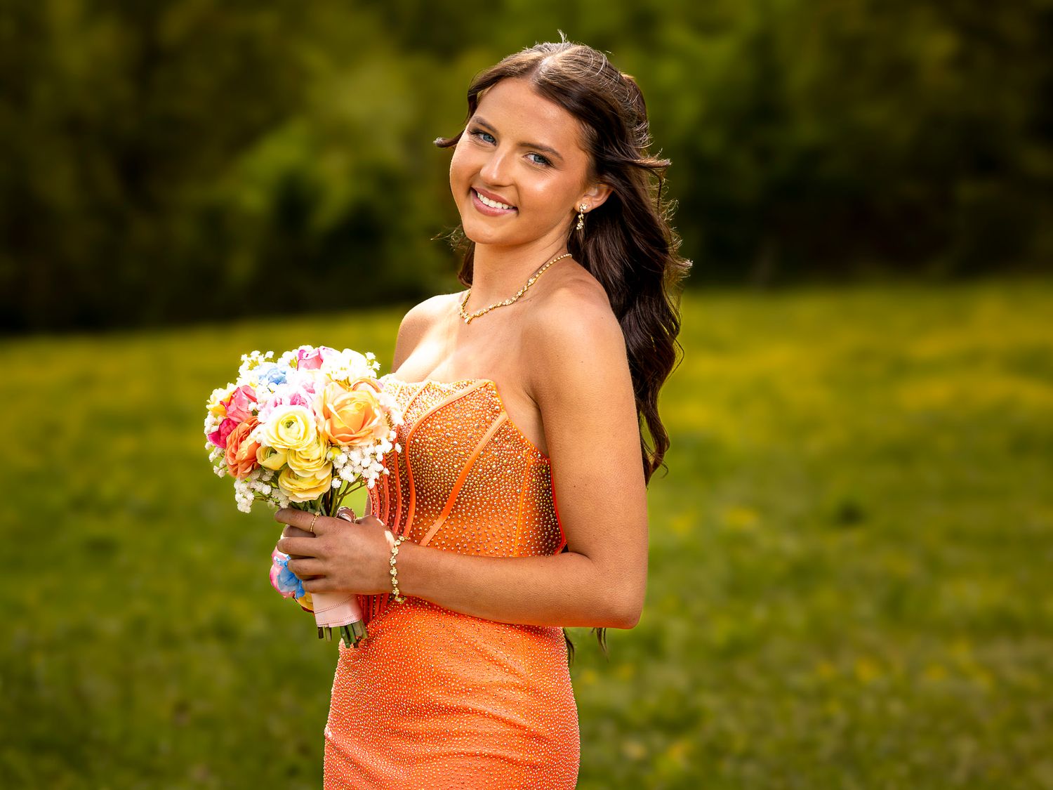 2026 Elkins AR senior Mallory Harris posing for her prom portraits in an open field setting.