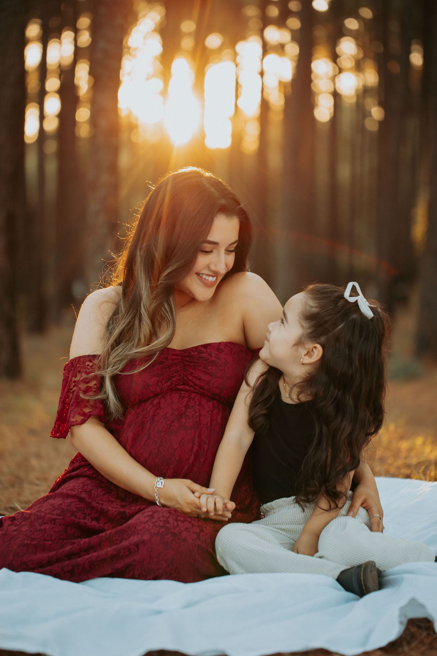 mother with daughter in maternity photo