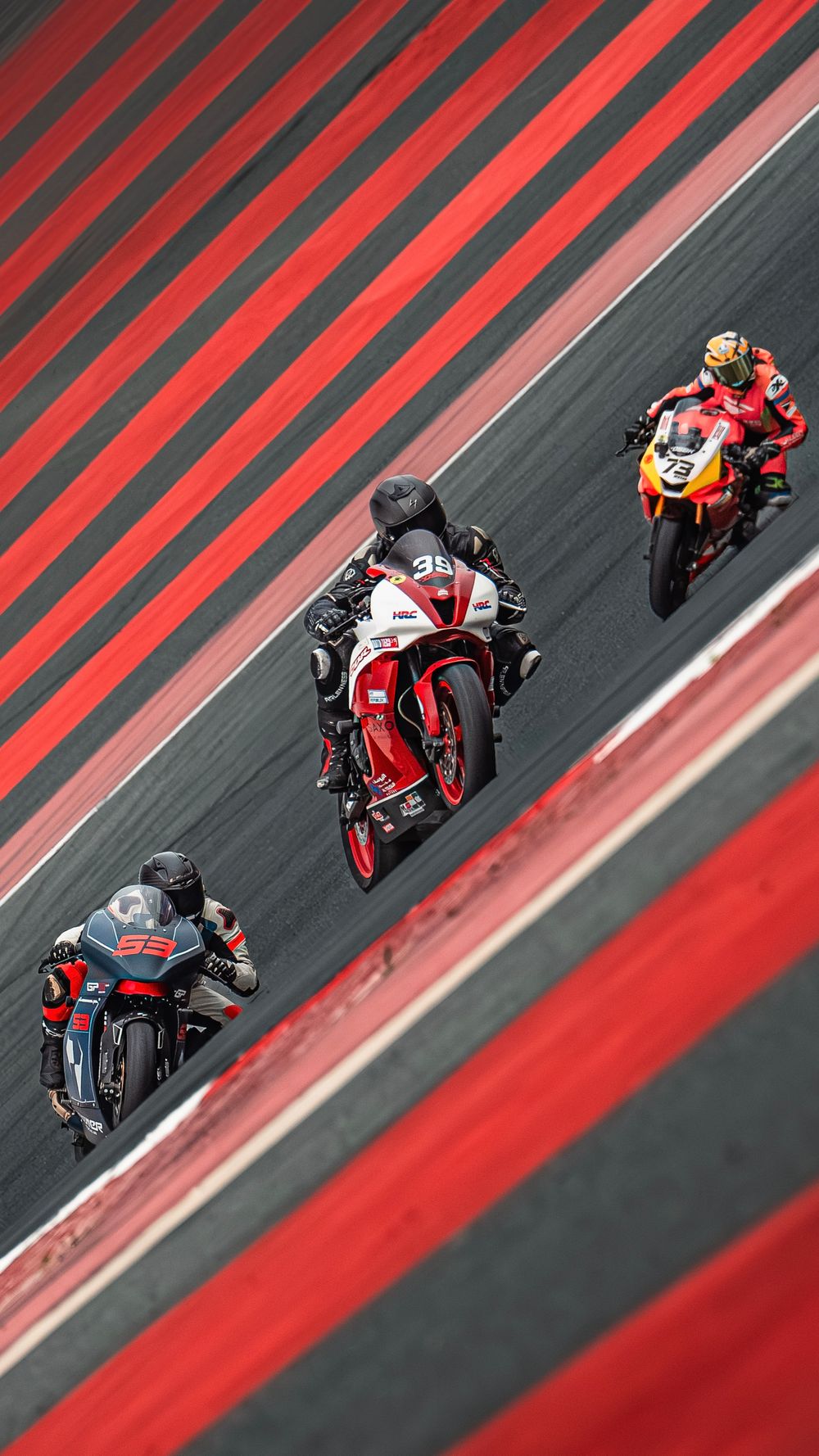 Motorcycle riders racing at DSBK Championship at Dubai Autodrome racetrack in Dubai UAE. Motorsports photography by Jasmina Noureldin.