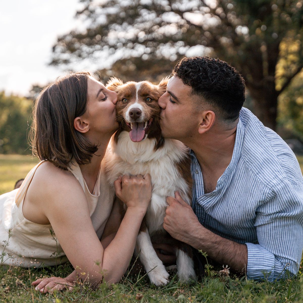 couple-kissin-their-dog-during-a-photoshoot-in-concord-sydney