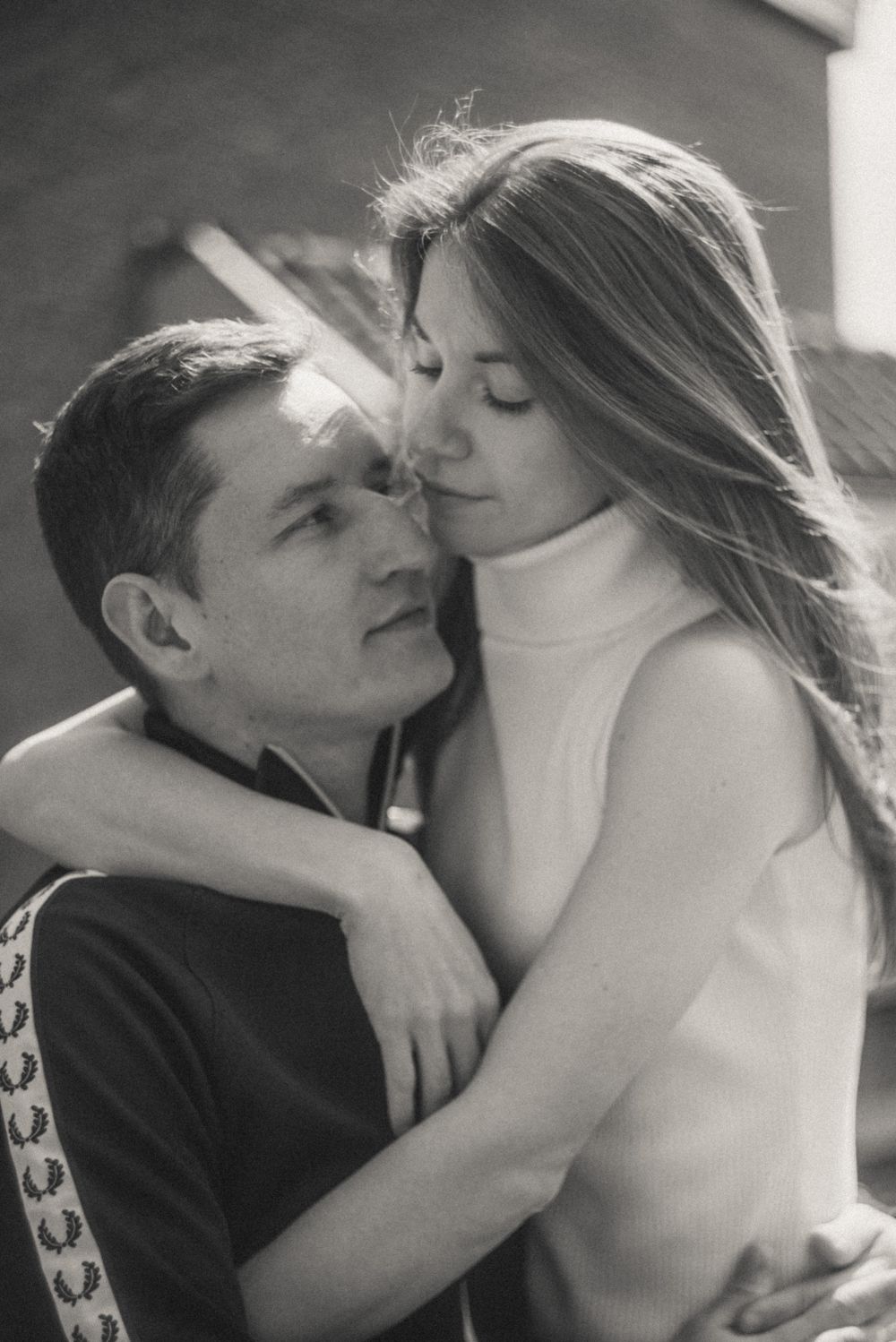 Intimate black and white portrait series capturing tender moments between a couple.