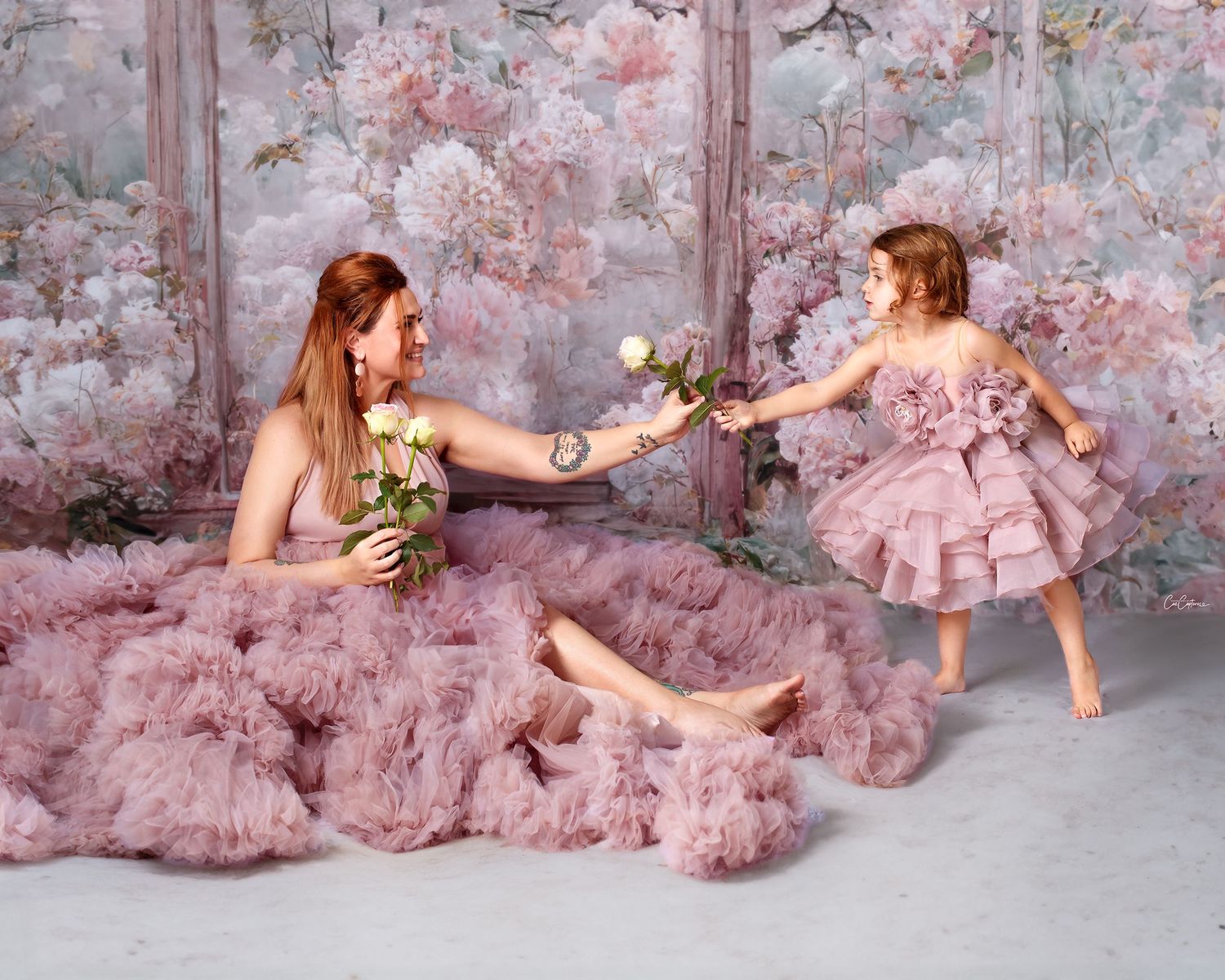 Motherhood studio session, mother and daughter in matching couture gowns, candid studio moment captured by Caz Captures.