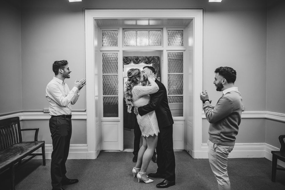 Black and white photos show couples dancing and embracing in a formal interior setting.