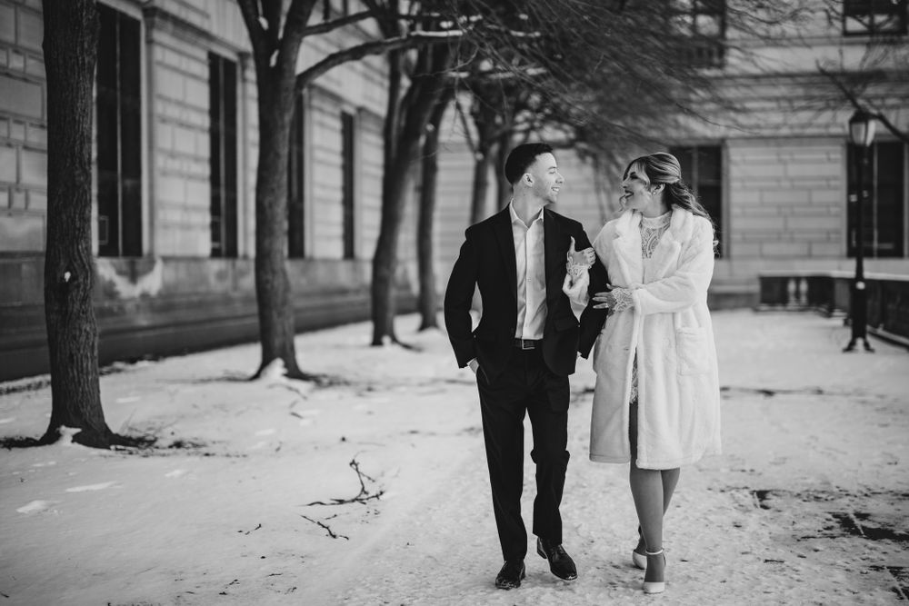 A couple shares an intimate moment during their first dance at a wedding reception.