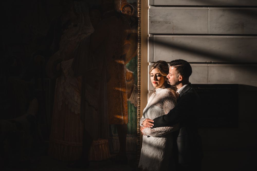 Intimate dance moments photographed in dramatic lighting within a historic building.