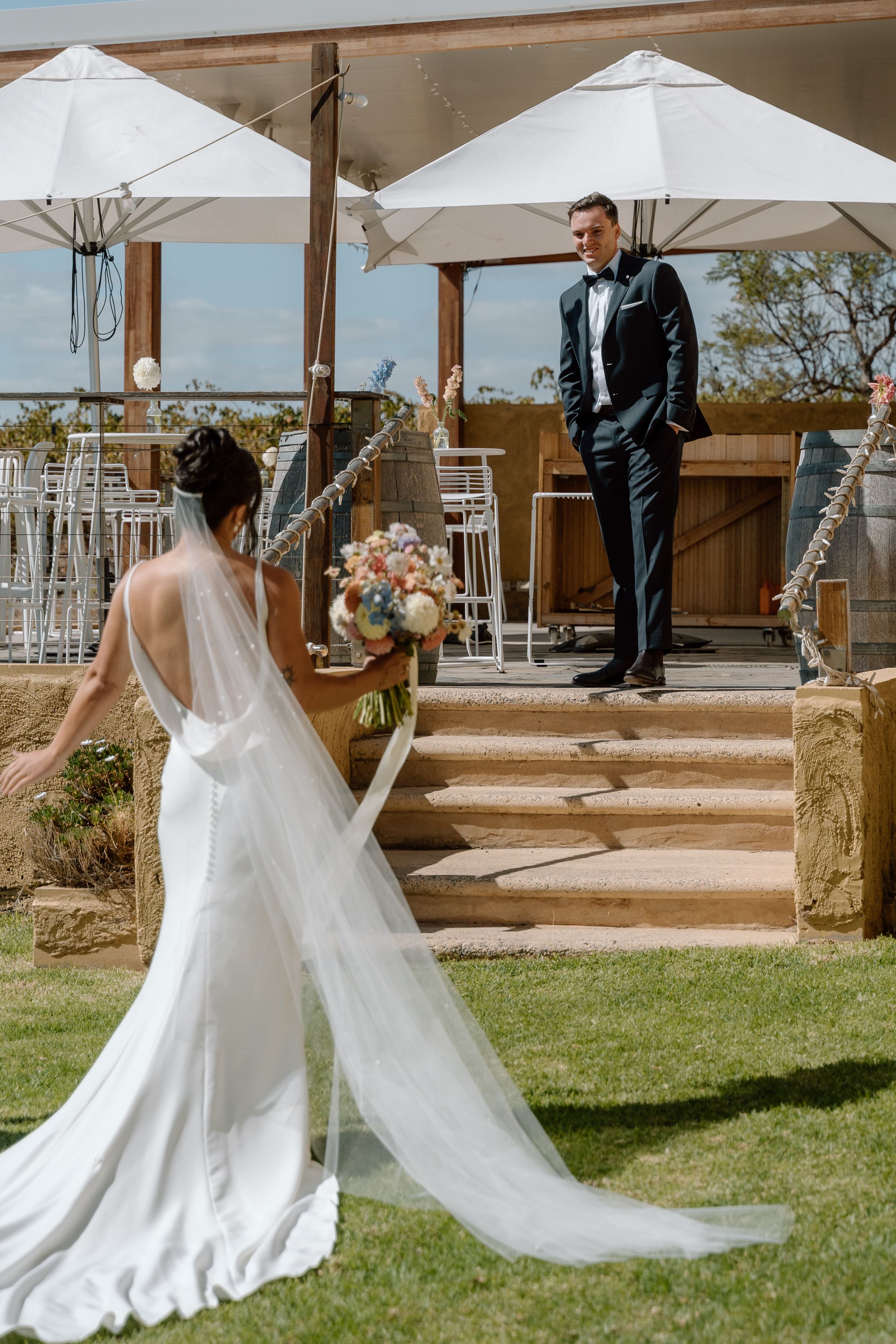 A series of wedding photos showing a bride in a flowing white dress approaching someone on outdoor wooden steps.