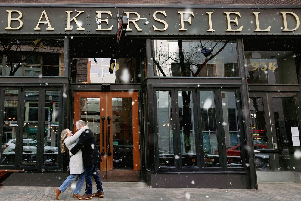 Exterior storefront of Bakersfield restaurant with large vintage-style lettering above glass windows and wooden entry door.