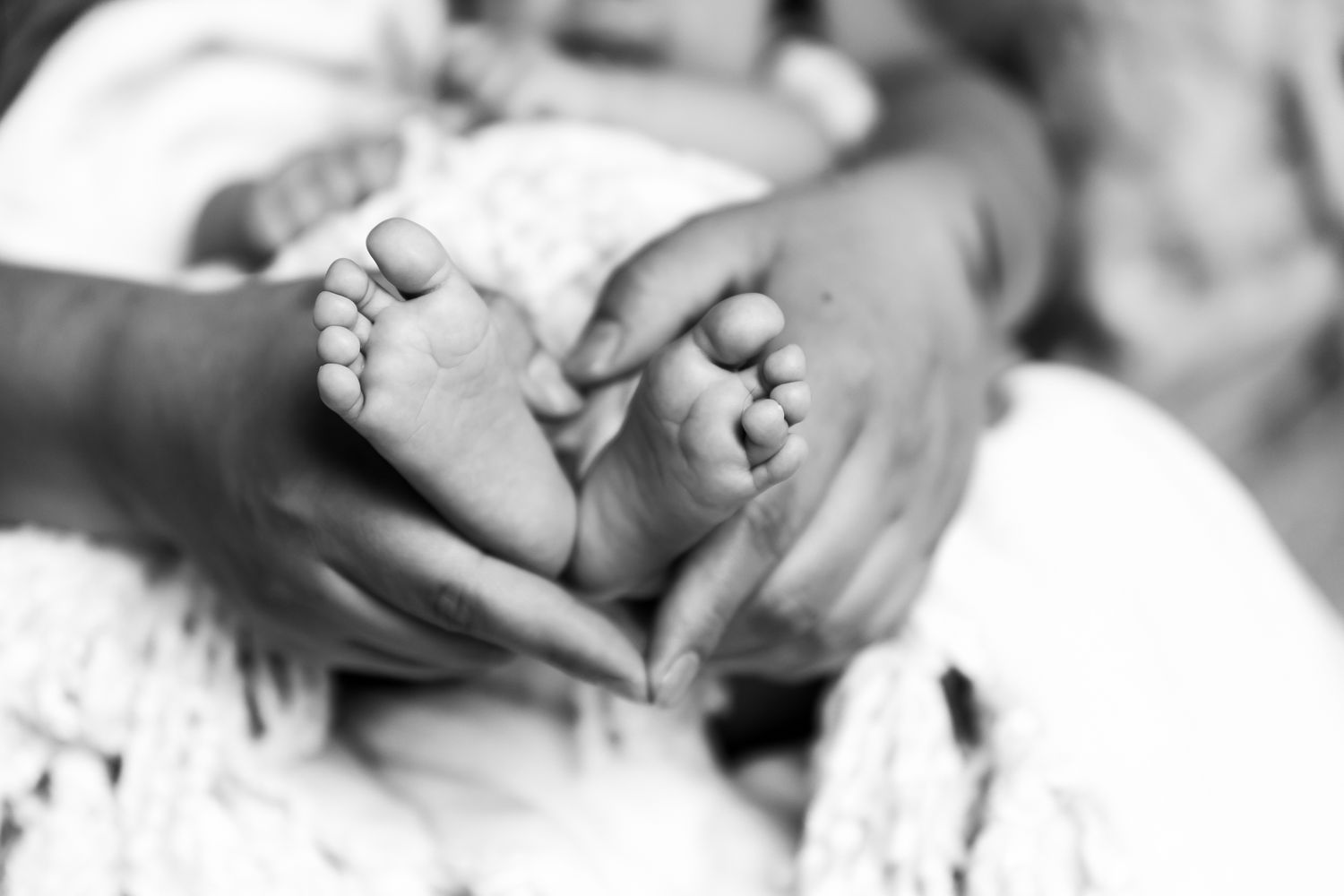 newborn lifestyle photoshoot of baby girl in her crib. Greeley colorado new born photography