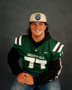 A student athlete in a green and white football jersey poses for a series of photos against a dark background.