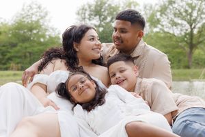 Family photography session during a picnic outdoors. Saving the memories and love.