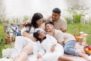 Family photography session during a picnic outdoors. Saving the memories and love.