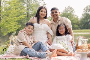 Family photography session during a picnic outdoors. Saving the memories and love