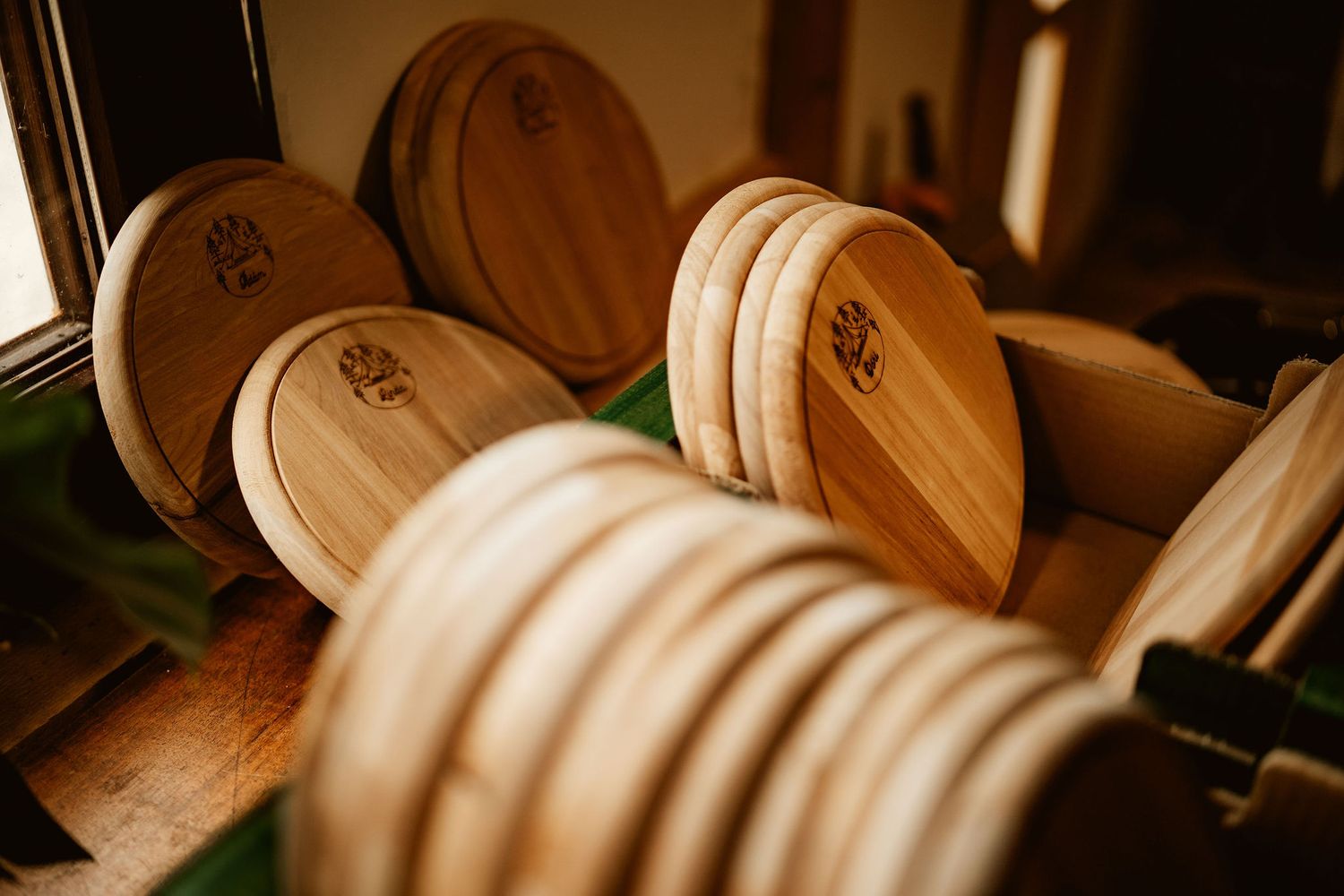 Close-up of wooden coasters stacked in rows.