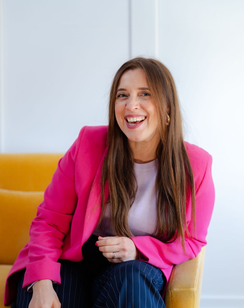 relaxed headshot of person on sofa in natural photography for website