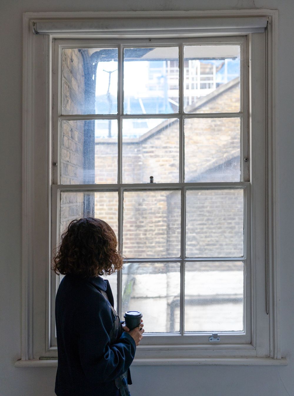 creative branding photography of woman looking out of window