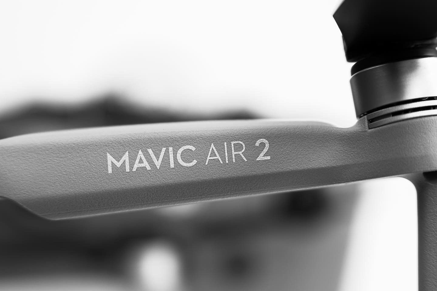 Side view detail of Mavic Air 2 drone body with text branding visible.