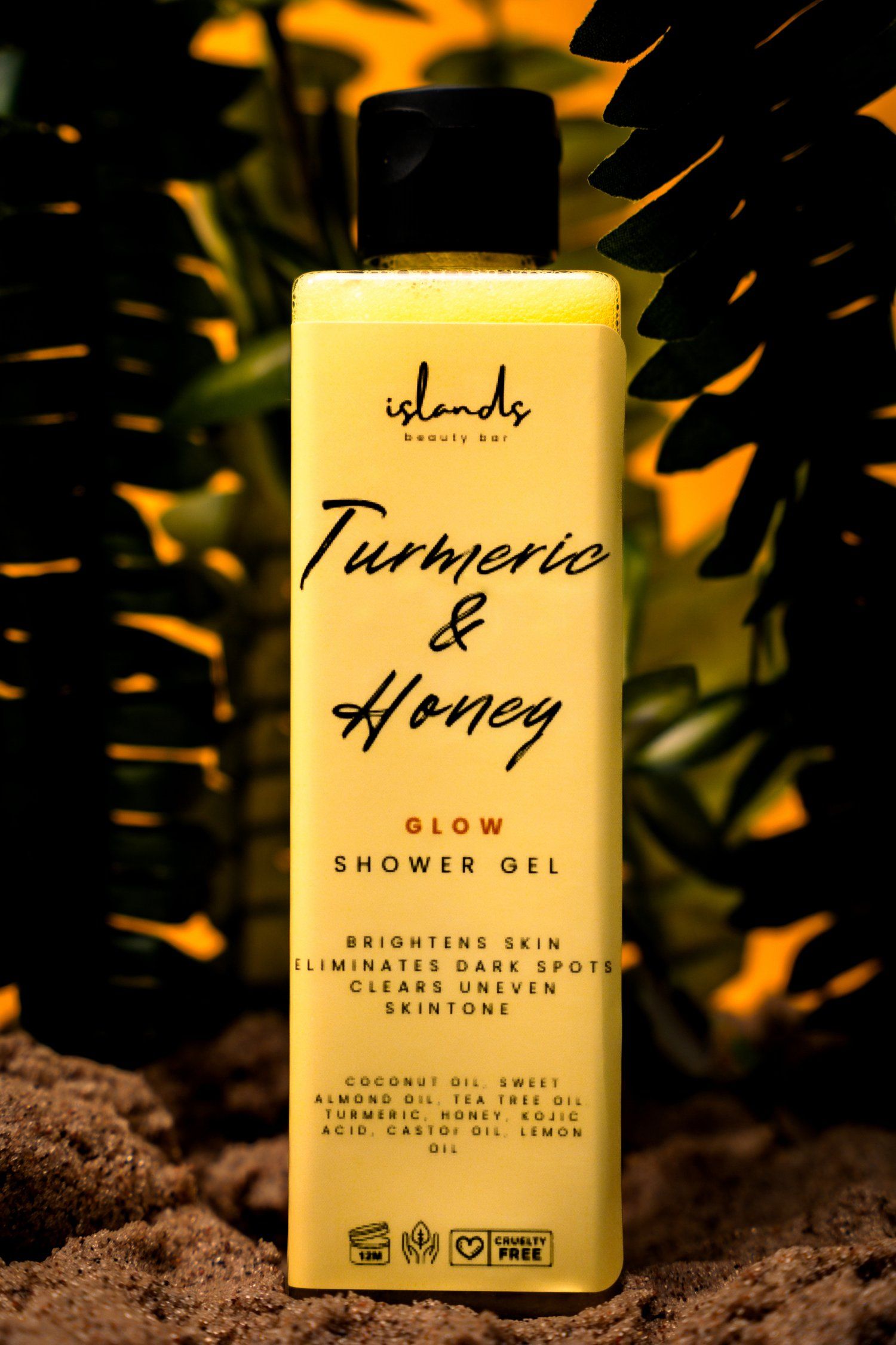 Islands Beauty Bar Turmeric & Honey shower gel with tropical plant shadows.