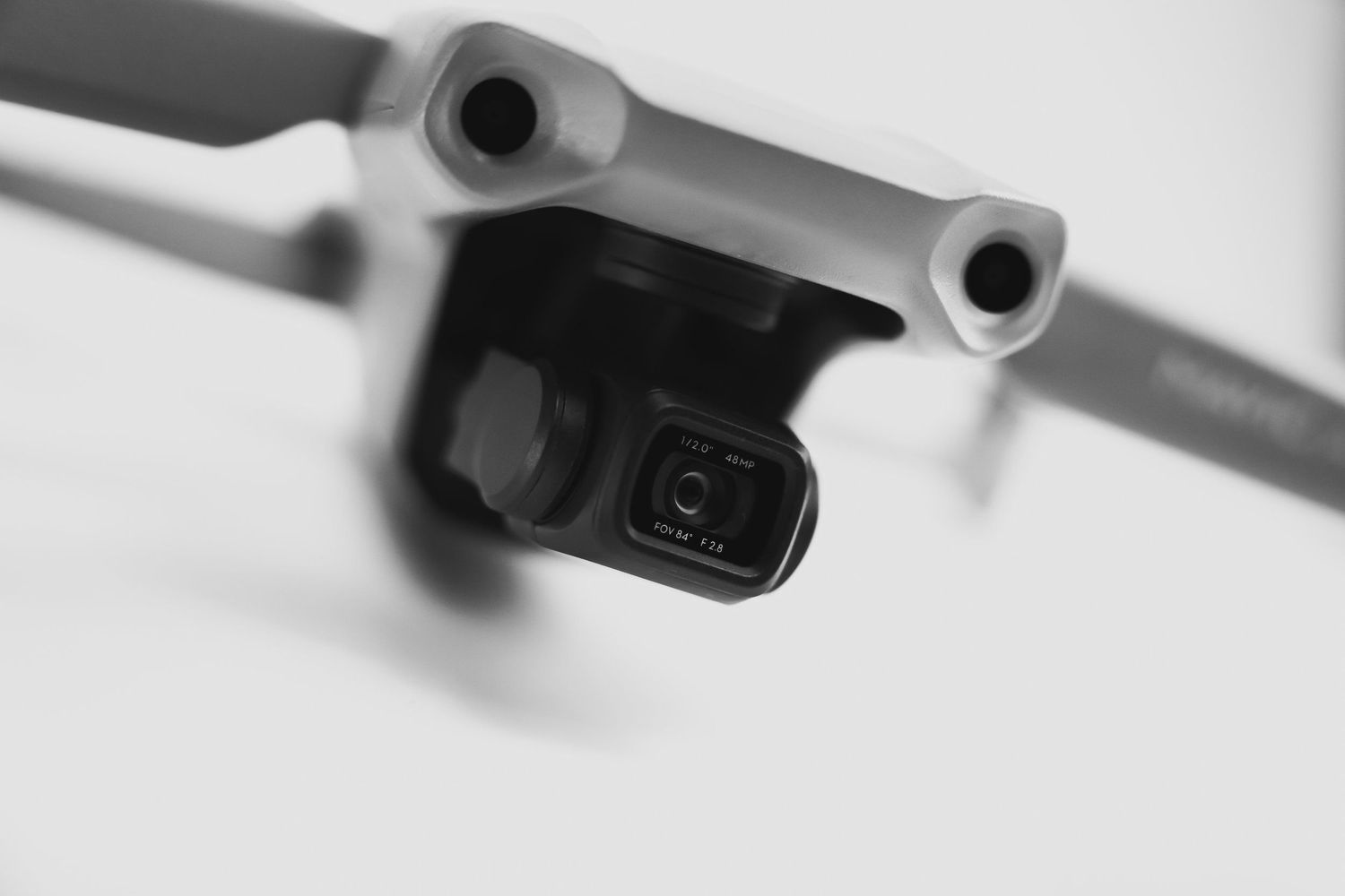 Black and white close-up of Mavic Air 2 front camera assembly.