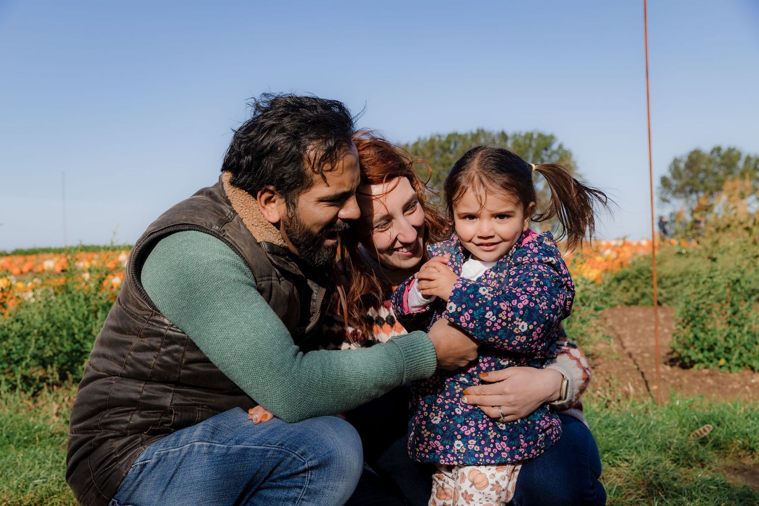 Family sharing a tender moment together at a pumpkin patch.  Photographer. Hull. East Yorkshire. Photography