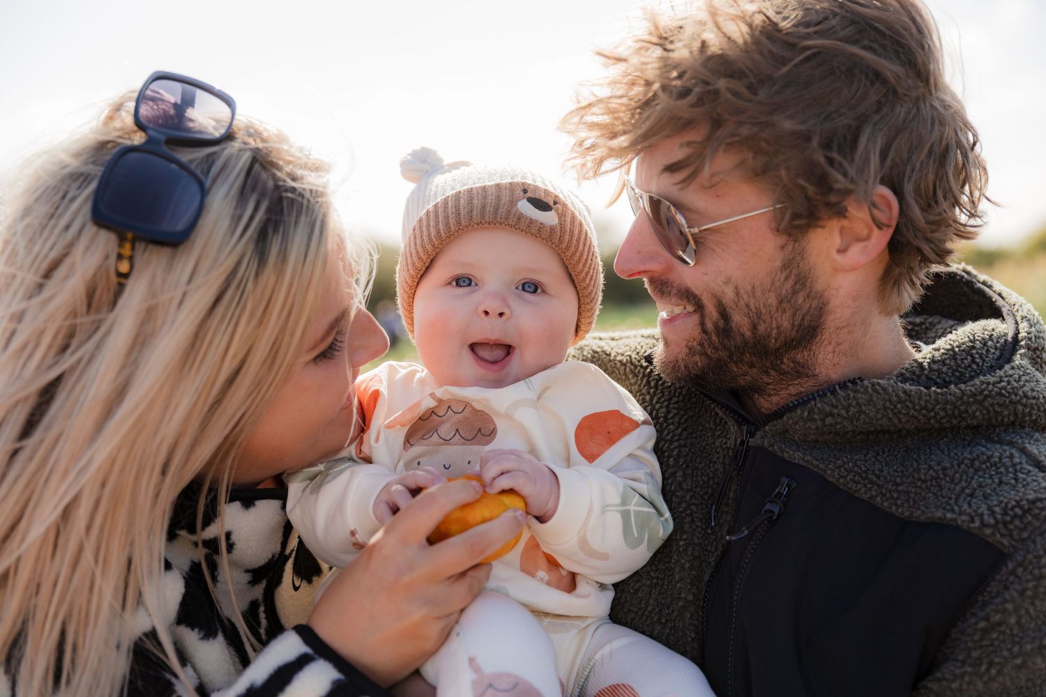 Parents sharing tender moments with their baby during an outdoor autumn photoshoot. Photographer. Hull. East Yorkshire.