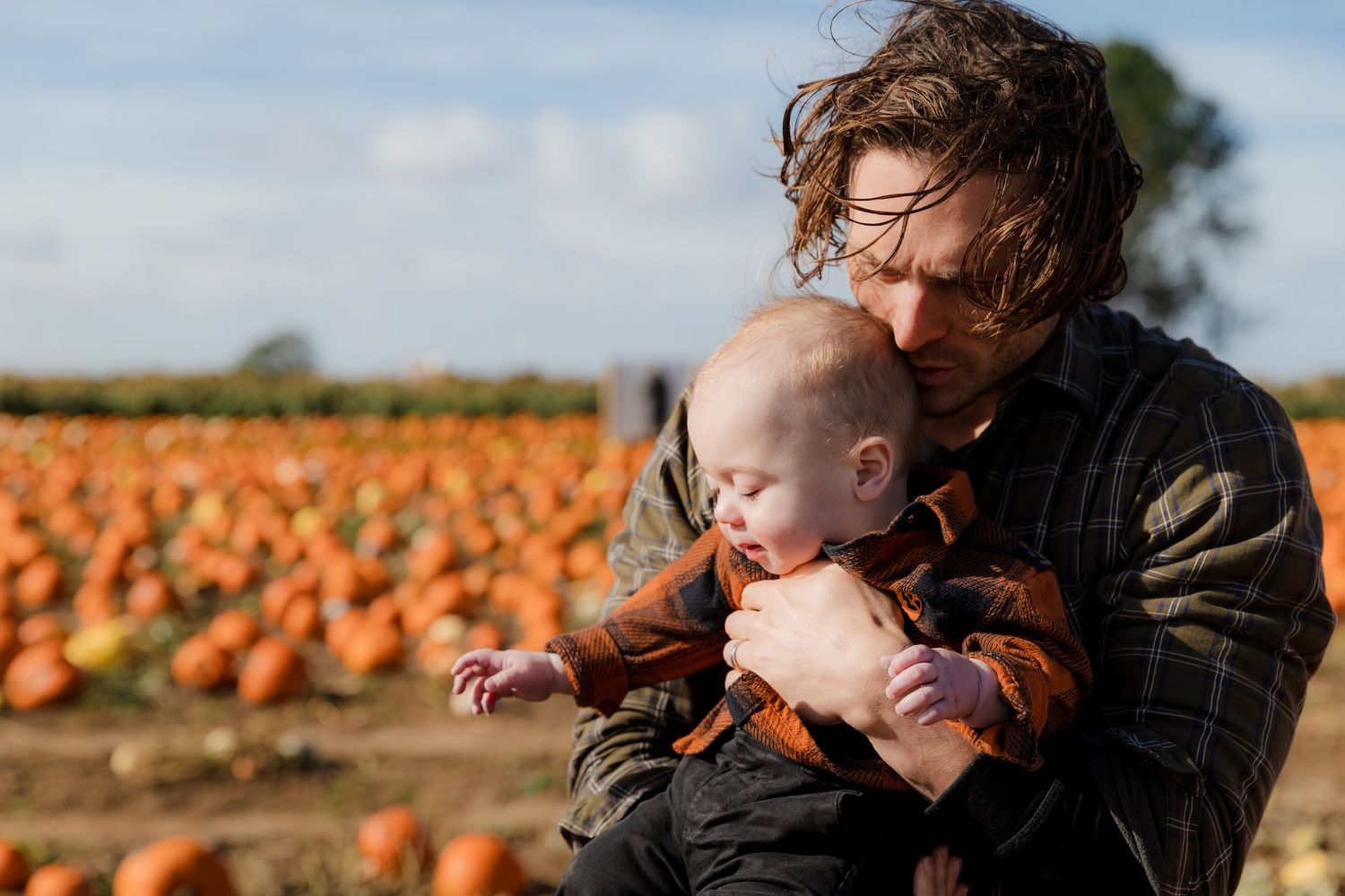 Family sharing joyful moments together at a scenic pumpkin farm. Photographer. Hull. East Yorkshire.