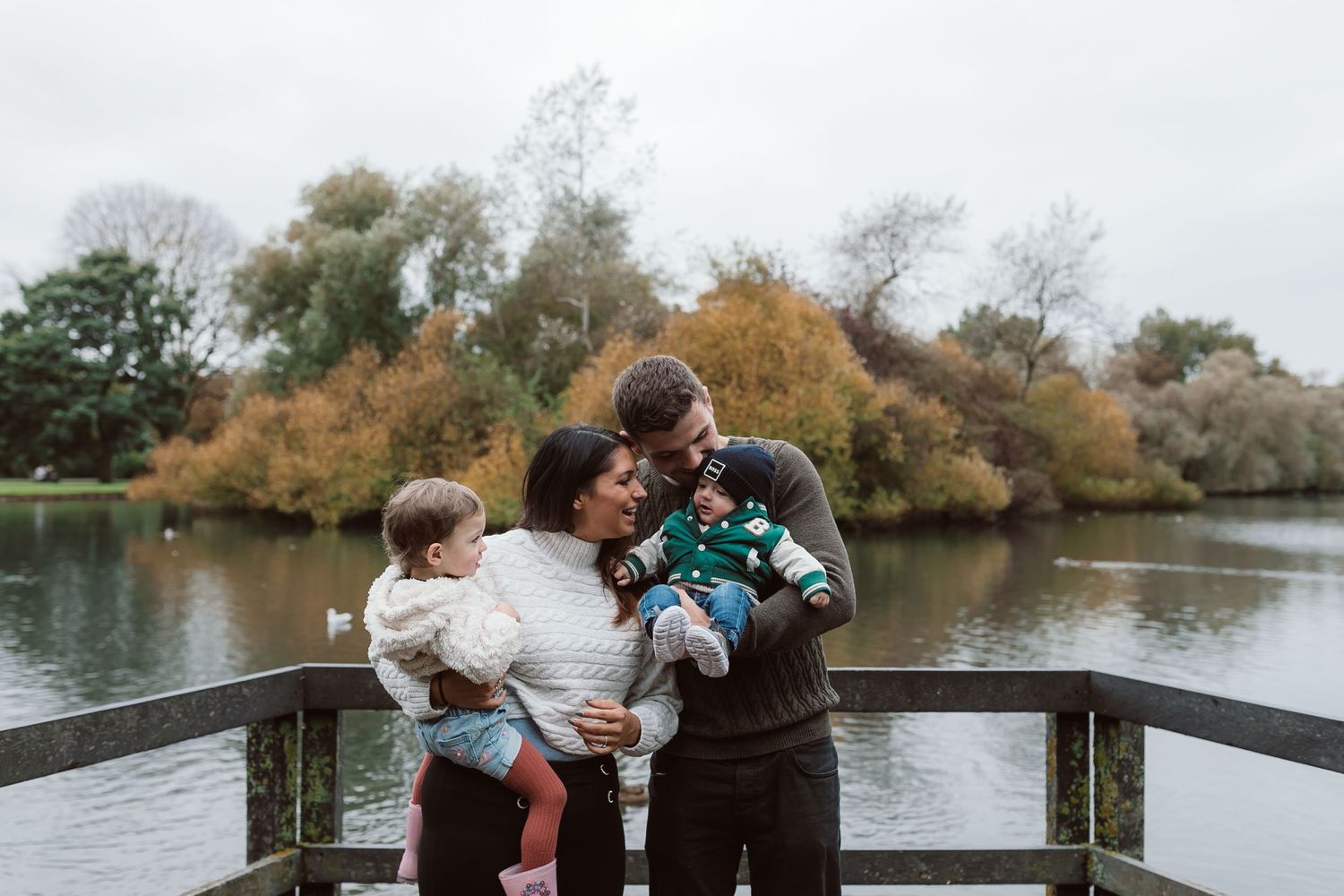 Family enjoying a scenic view together on a wooden bridge over a lake during fall. Photographer. Hull. East Yorkshire. Photography
