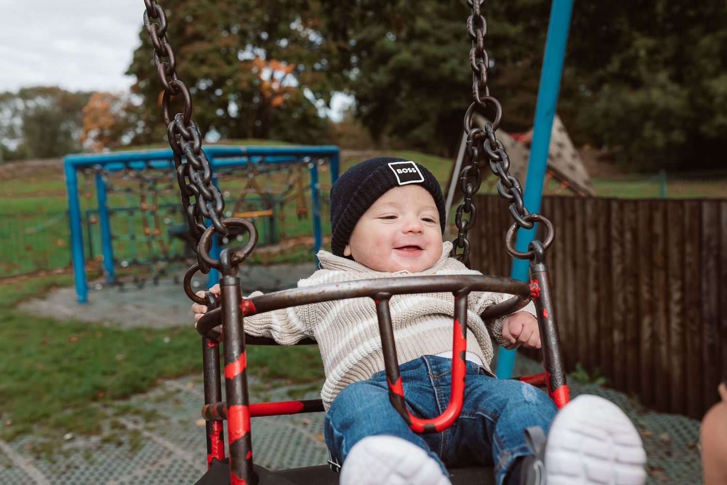 Joyful moments captured on playground swings during a fall day. Photographer. Hull. East Yorkshire. Photography
