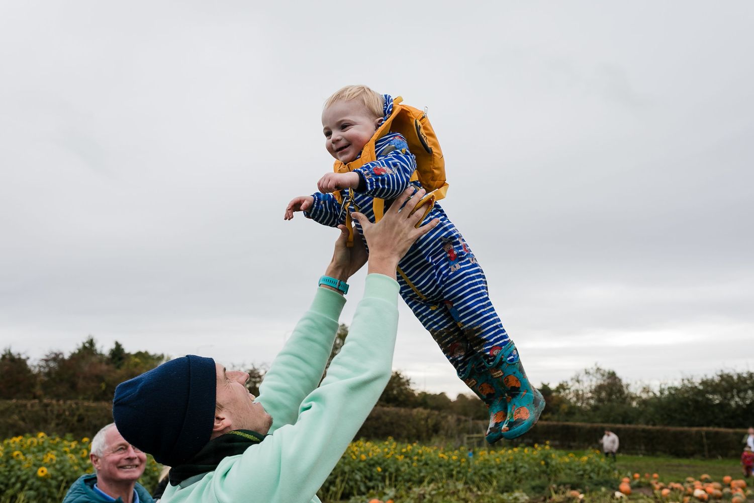 Kids play and roll around in a pumpkin patch on a cloudy day. Photographer. Hull. East Yorkshire. Photography